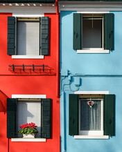 Wooden Frame Windows Of Red And Blue Buildings