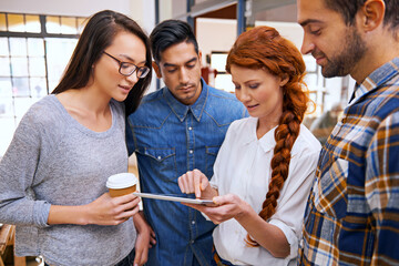 Poster - Shes got some great ideas. Shot of a designer with a tablet sharing her ideas with her colleagues.
