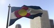 Colorado state waving flag on blurry background, USA state news illustration. Blurry background