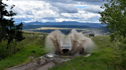 Sticker - Car driving on a puddle splashing mud