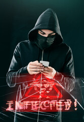Fototapete - not even your smartphone is safe. shot of a computer hacker using a smartphone while standing agains