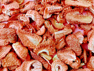 Food background of closeup of freeze dried red strawberry slices