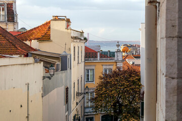 Wall Mural - Rooftops and houses of the Alfama district, the oldest neighborhood of Lisbon with traditional houses, Portugal, Europe