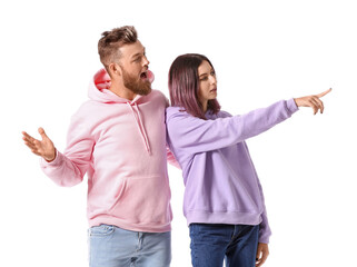 Wall Mural - Cool young couple in hoodies on white background