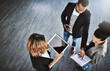 © D Donson/peopleimages.com - Hard work paired with teamwork puts you at the top. High angle shot of a group of businesspeople having a discussion in an office.