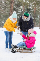 Poster - Little girl and her grandparents with thermos on snowy winter day