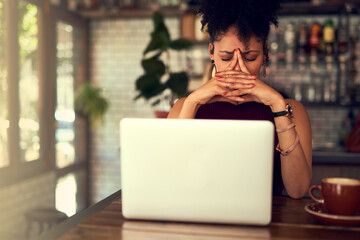 Poster - Some things just arent meant to work out. Cropped shot of a young woman looking stressed out while working on her laptop in a cafe.