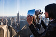 © Mauro Grigollo/Stocksy - A woman looks at new York cityscape from a rooftop