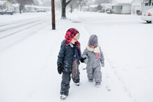 Kids Hold Hands In Snow