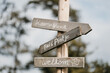 © Melissa Milis Photography/Stocksy - Wedding direction sign in wood