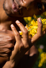 Close-up Of Man Holding Flowers 