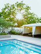 © Trinette Reed/Stocksy - Architecture image of Cabanas and luxury spa pool