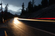 © unite images/Stocksy - light trails on mountain road