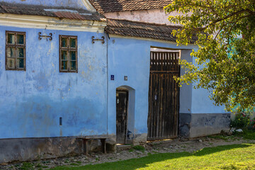 Wall Mural - View of picturesque village Viscri in Romania. Painted traditional old houses in medieval Saxon village of Viscri, Romania, 2021