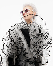 Senior Lady In Extravagant Outfit And Sunglasses