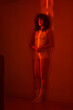 © Ivan Ozerov/Stocksy - Sensual woman in red light