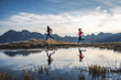 © plpictures by Paedii Luchs/Stocksy - Active couple running along alpine lake