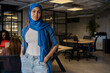 © Luis Velasco/Stocksy - Portrait Of A Muslim Businesswoman In The Office.