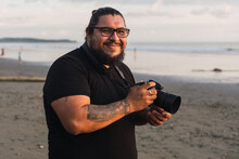 Photographer On The Beach