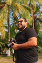 Man Holding His Camera Outdoors