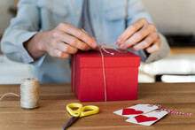 Close-up Of Man Making Wrapping Present