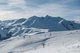 Fototapeta Góry - Snowy winter mountains in sun day. Georgia, from ski resort Gudauri.