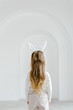 © Sergey Narevskih/Stocksy - Girl in bunny ears in studio