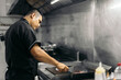 © Pedro Merino/Stocksy - Latin chef cooking tacos