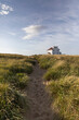 © Raymond Forbes LLC/Stocksy - Race Point Architecture on Cape Cod Beach Landscape