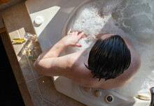 Man Relaxing In Spa Bath