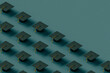 © Giada Canu/Stocksy - black Graduation caps with copy space. 3d render