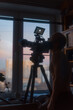 © Ivan Andrianov/Stocksy - Man Filming Moon Telephoto Lens At Home