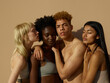 © ohlamour studio/Stocksy - A relaxed group of diverse friends embracing