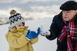 © Ani Dimi/Stocksy - Grandpa And Grandson having fun on the snow