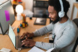 © Studio Marmellata/Stocksy - Happy male freelancer working on laptop at home