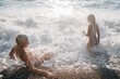 © Evgenij Yulkin/Stocksy - Children in sea water