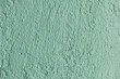 © Shava Cueva/Stocksy - light green color wall texture in Mexico