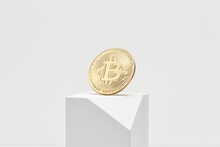 Bitcoin And Block Against Gray Background