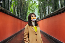 Asian Woman With A Colorful Mask