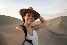 Smiling Young Woman In The Desert
