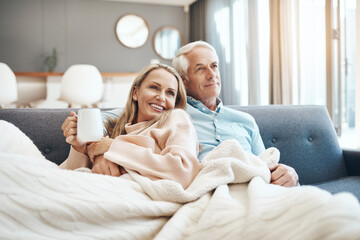 Poster - Coffee, couch, comfortability and you is all I need. Cropped shot of a mature couple relaxing on the sofa at home.