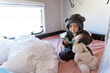 © Gemma can fly/Stocksy - Cute happy baby on bed in a motorhome