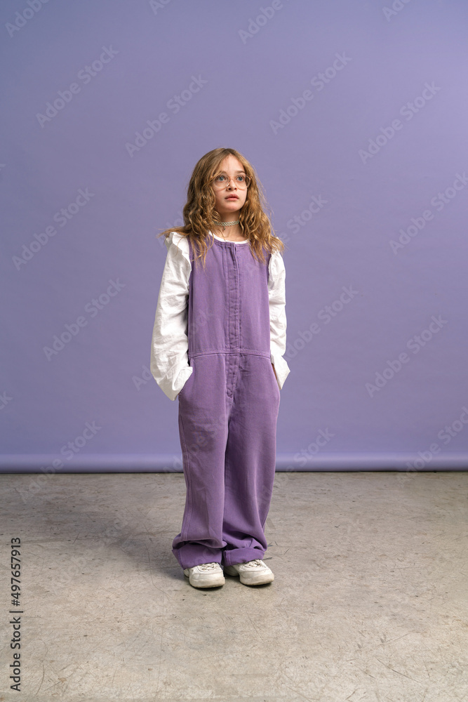 Calm stylish girl modeling in studio Stock Photo | Adobe Stock