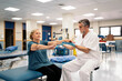 © Santi Nuñez/Stocksy - Doctor checking coordination of elderly woman