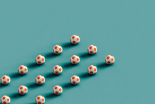 Rows Of Soccer Balls Ona  Blue Background. 3d Render
