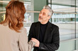 © Ivan Gener/Stocksy - Businessman shaking hands with a colleague outside