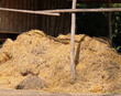 haystack with straw and hay near the barn to feed the animals