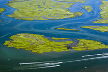 Wetlands With Speedboats Near Airport, New York, USA
