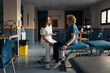 © Santi Nuñez/Stocksy - Happy female doctor and patient talking during visit