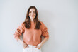 © Galina Zhigalova - Portrait of happy young beautiful woman with dark long hair in knitted casual sweater on white background isolated, generation z